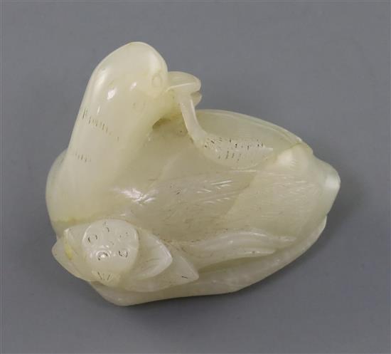 A Chinese white jade figure a duck, 19th century, 5.2cm, wood stand